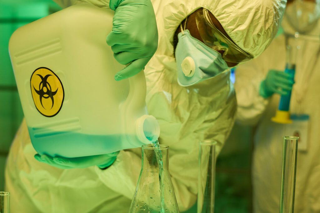 African Chemist working with radioactive chemicals