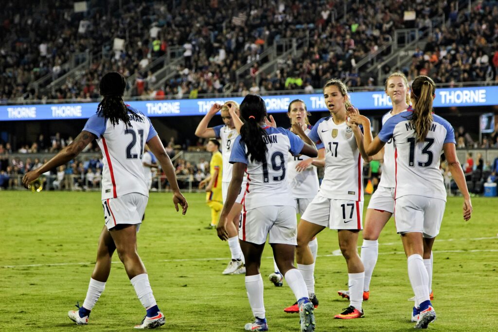 Women's football/soccer team getting on to the pitch for their match