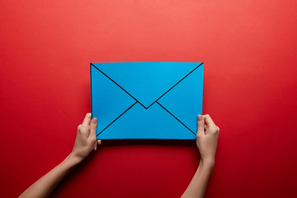 top view of blue mail sign on red background