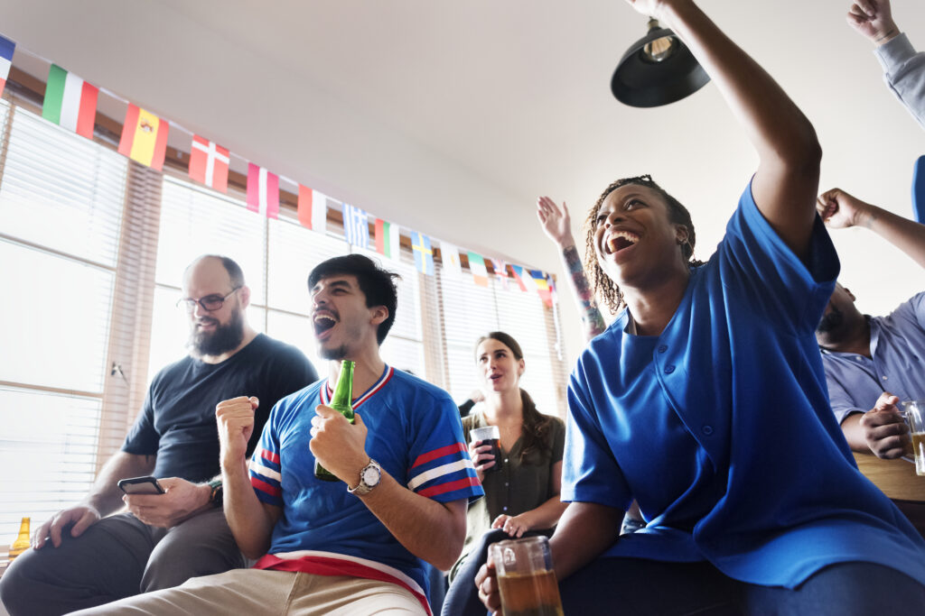 Friends cheering sport at bar together