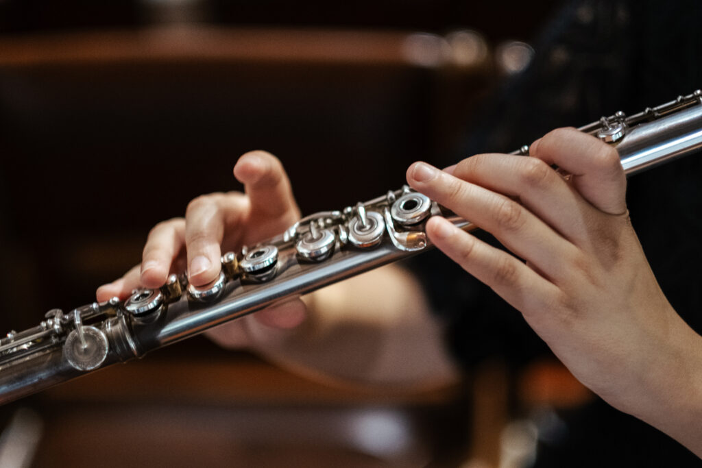 Shot of woman plaing flute